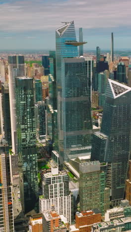 midtown manhattan architecture at sunny daytime. river waterfront with docks and lively traffic. vertical video