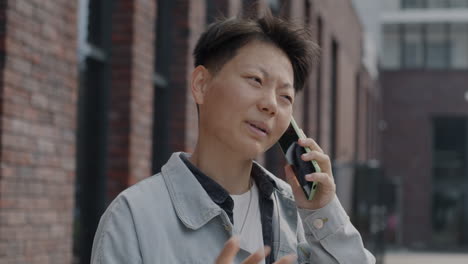 person talking on phone on street