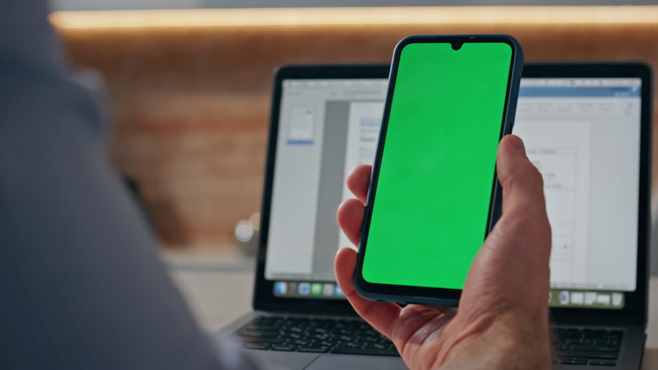Closeup mockup cellphone scrolling man finger at workplace. Manager browsing