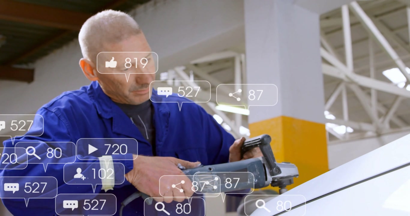 Engaging grinder mechanic in blue coveralls polishing hood for repair at shop, rising social icons