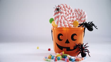 halloween bucket filled up with lollipop 4k