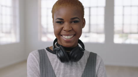 portrait of cool trendy african american woman smiling happy enjoying successful lifestyle change in new apartment