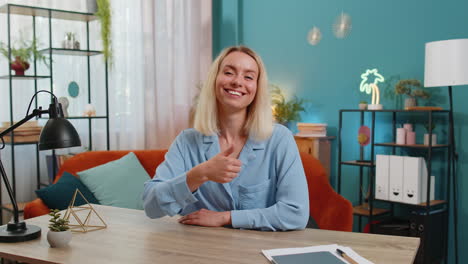 young businesswoman showing thumbs up like sign positive something good great news positive feedback