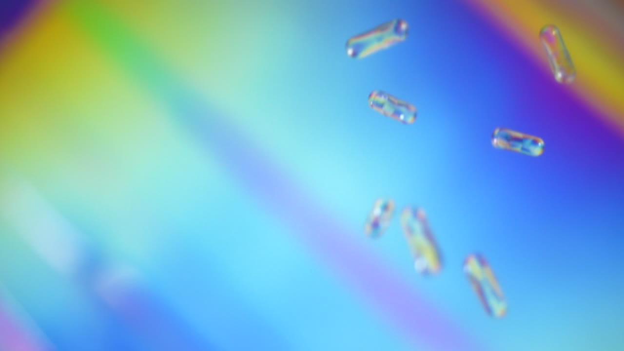 Colourful capsule pills falling in a psychedelic world