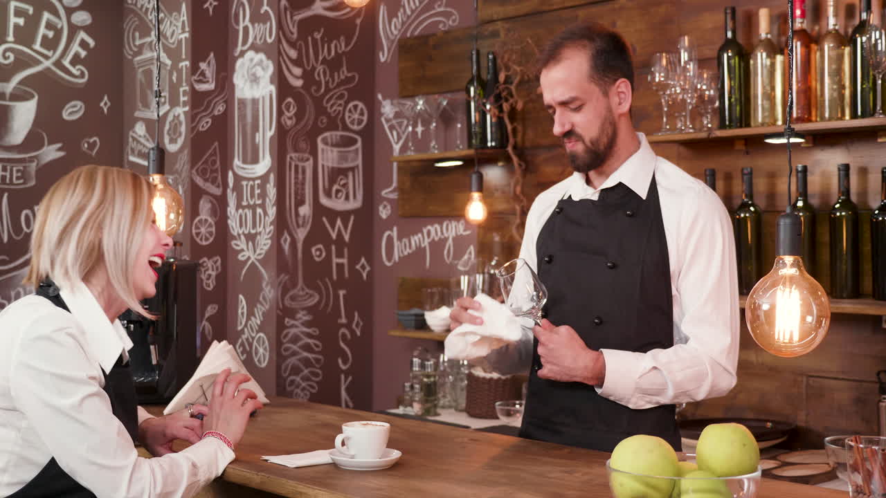 Bartenders working in a cafe