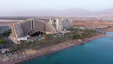 Aerial-view-of-Dan-Eilat-hotel-and-Royal-beach-at-Eilat-city-coastline,-Israel