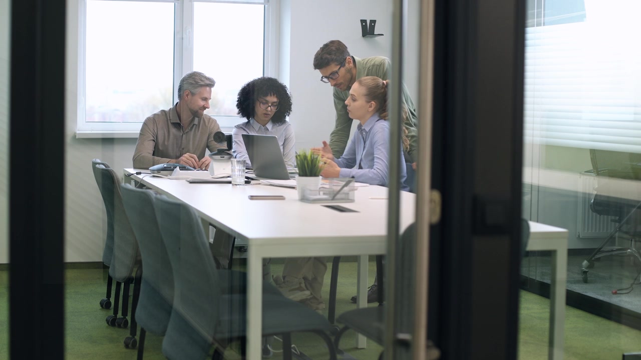 Diverse Business Team Collaborating in a Modern Office Meeting Room