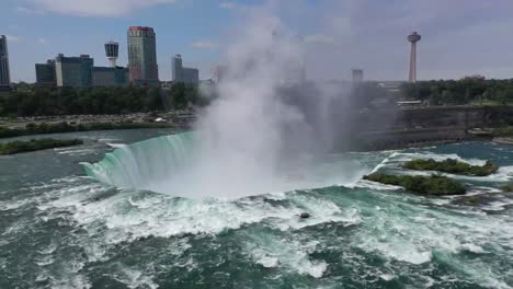 Aerial-perspective-captures-the-ethereal-beauty-of-the-cascading-water-shrouded-in-mist-creating-a-dreamy-and-peaceful-environment