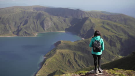 Travel-girl-amazed-by-the-beauty-of-fire-lagoon-Azores-Sao-Miguel-Portugal