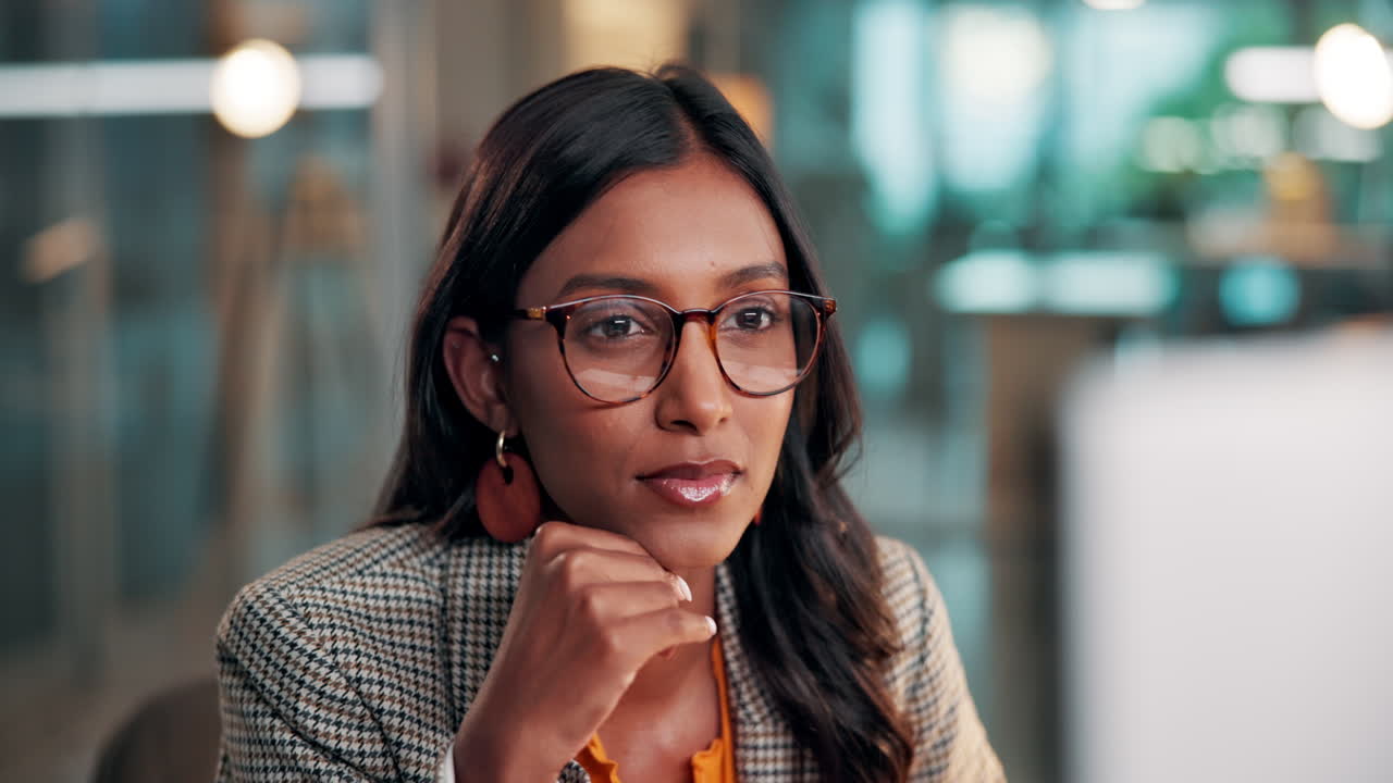 Close-up of Focused Businesswoman Wearing Glasses in Office