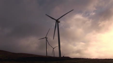 Backlit-windmill-generates-electrical-power-on-a-hillside-in-California-1