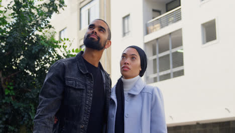 young couple standing in street 4k