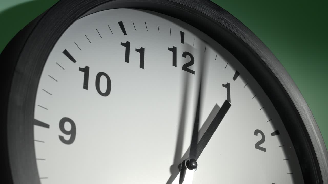 Clock Face on Light Green Wall in Time Lapse