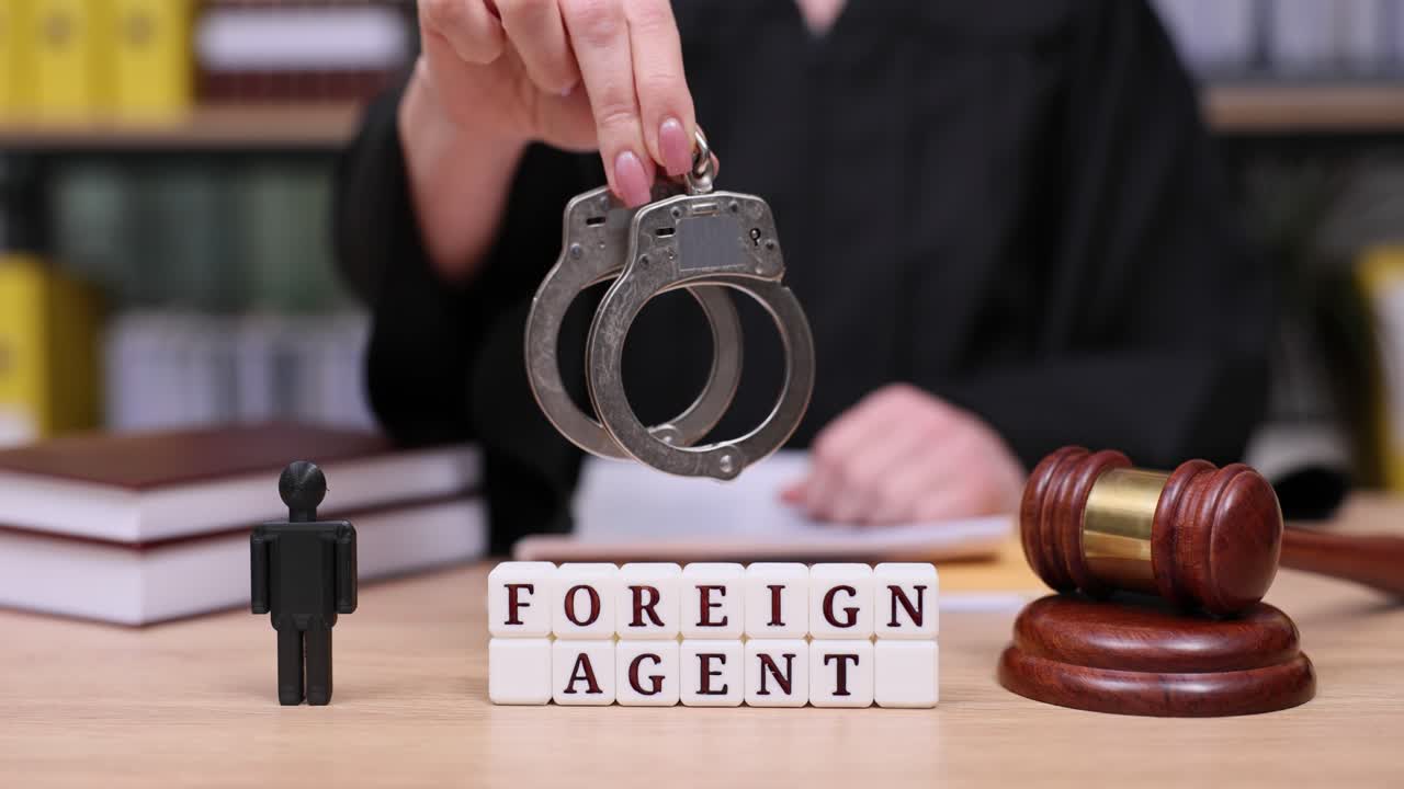 Foreign Agent Handcuffs and Gavel