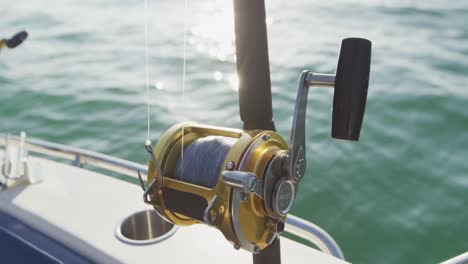 close up detail of a fishing rod standing up on a boat