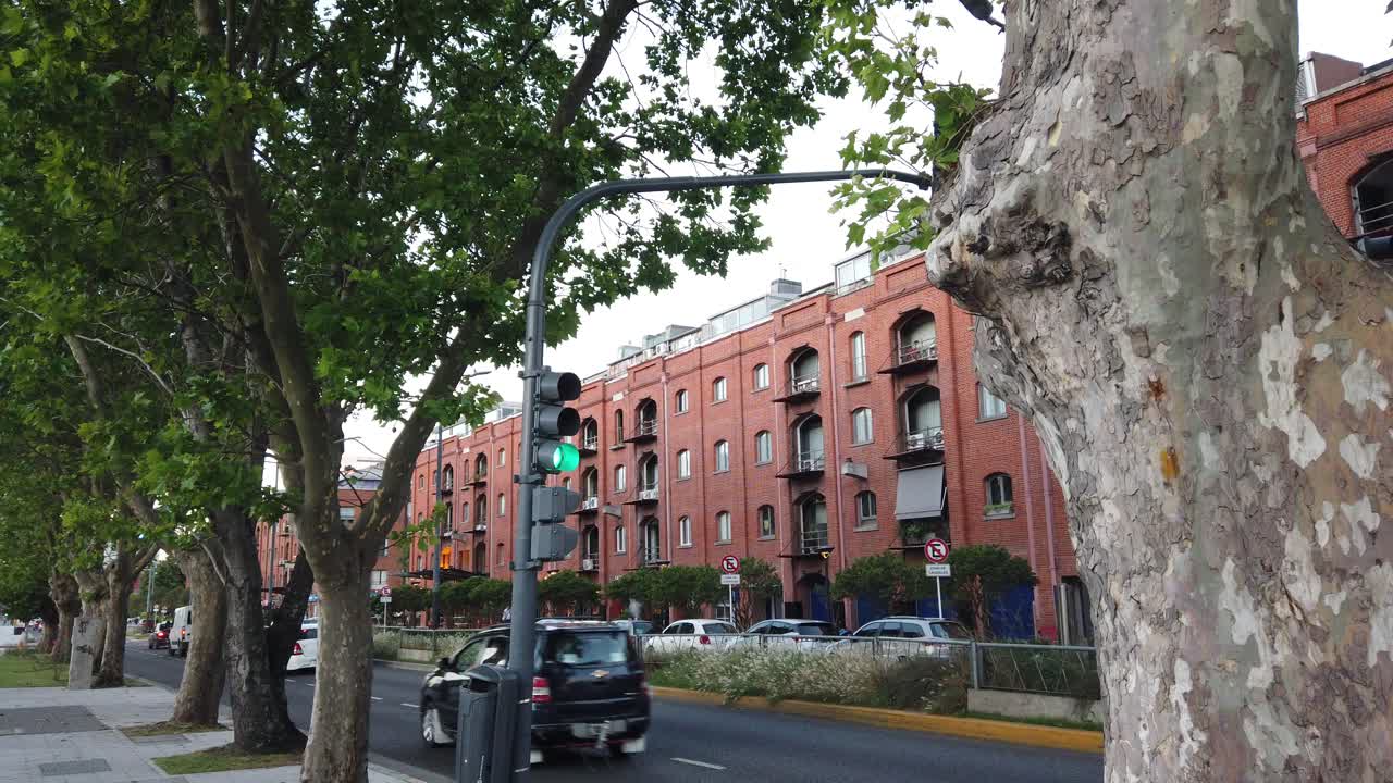 City Street with Red Brick Buildings and Green Trees