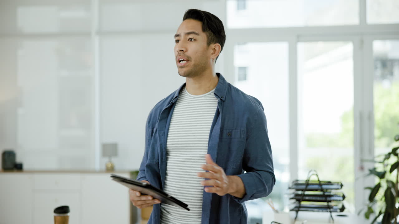 Man Presenting with Tablet in Office