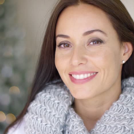 friendly young woman celebrating xmas at home