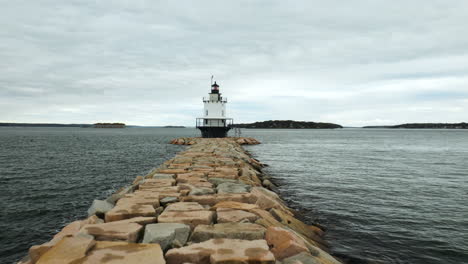 stunning aerial wide angle flying over spring point ledge lighthouse, maine