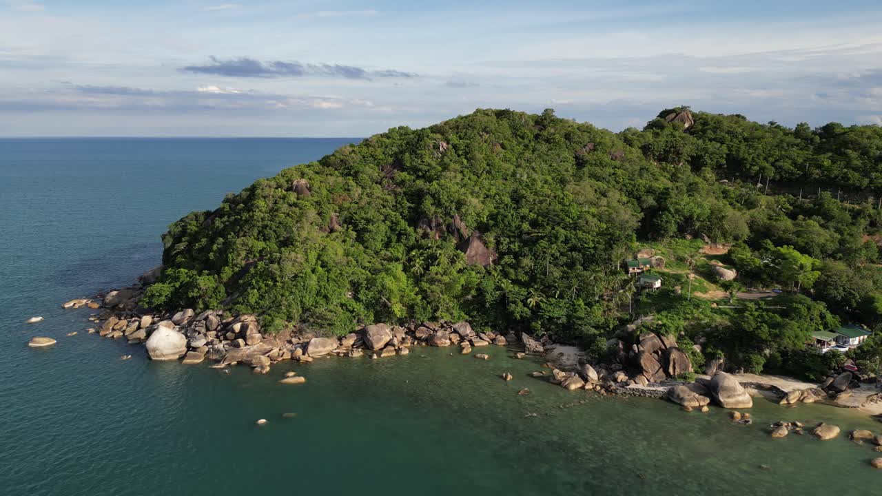 Aerial footage of clear blue waters and sky surrounding Koh Samui's western point