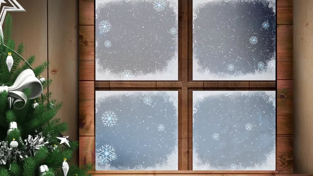Christmas tree and wooden window frame against snow falling over winter landscape