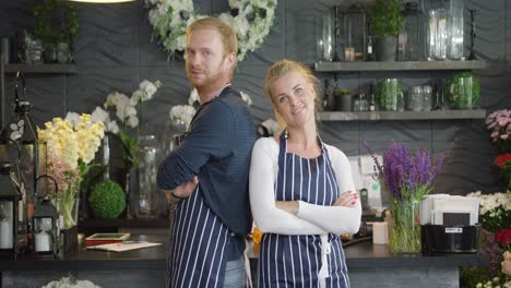 young workers in floral shop posing