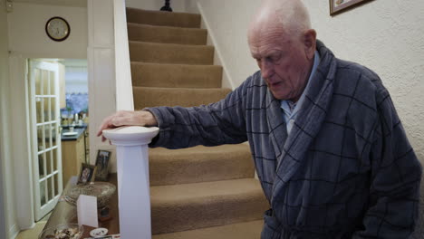 elderly man on staircase at home