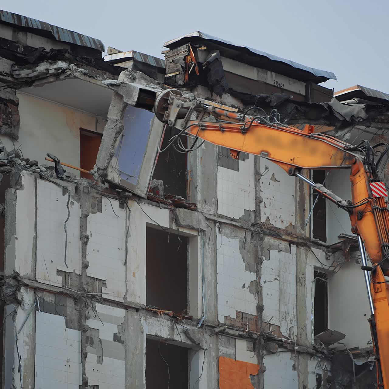 Urban excavator destruction demolishing. Demolition building after nature disease