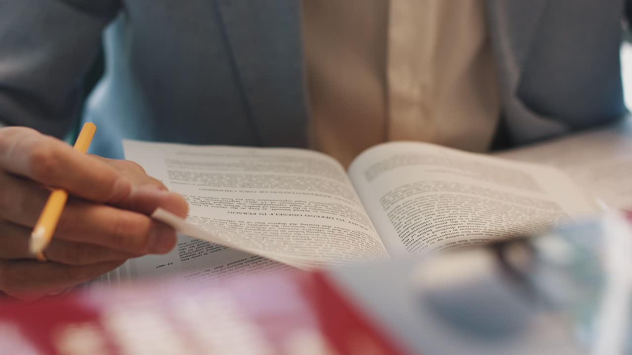 A man turns over the blank pages of the diary