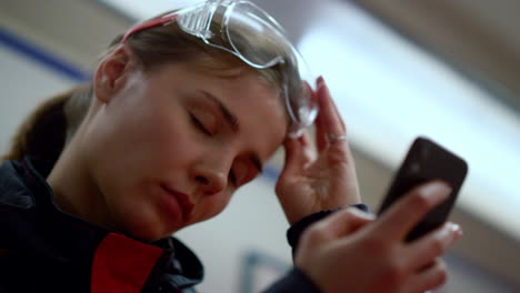 exhausted doctor using mobile phone.