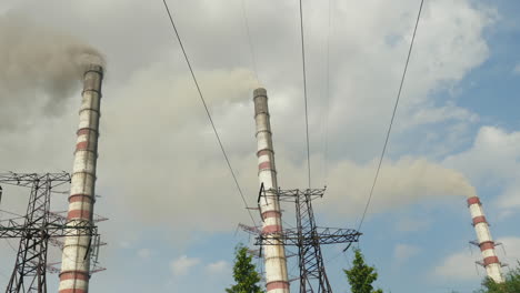 a pipe of a chemical plant billowing thick black smoke