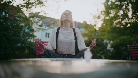 woman meditating in a park