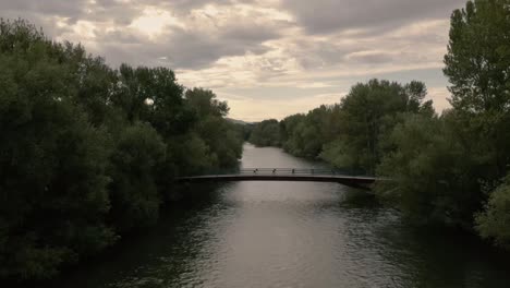 Aerial-drone-shot-of-Boise-River-pan-up-to-downtown-Boise