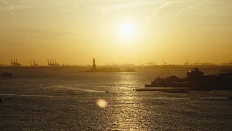 golden sunset over the statue of liberty