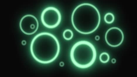 Pulsating-green-neon-rings-in-various-sizes-glowing-on-black-background