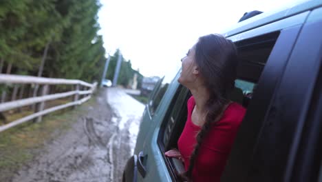 woman enjoying a scenic drive through the mountains