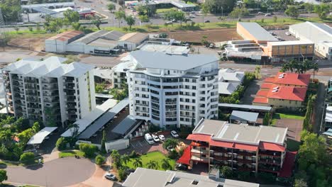 Drone-shot-of-white-apartment-buildings-in-a-small-quiet-court