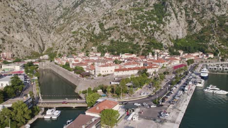 kotor, montenegro: skurda river's confluence with the bay, surrounded by oldtown and towering limestone cliffs