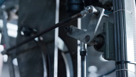 manufacture machine part rotating at technological conveyor automat line closeup