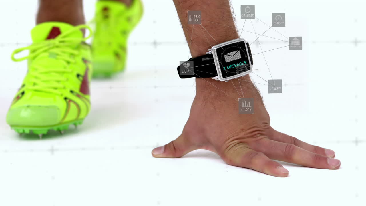 atleta en posición inicial con un reloj inteligente alrededor de su cintura