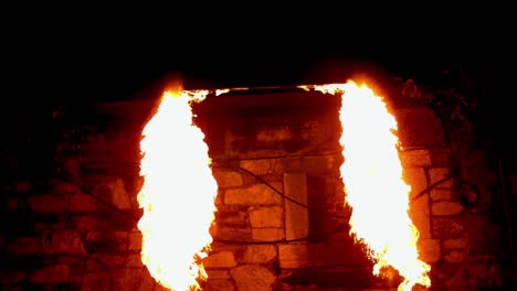 fire dancer playing with fire in the dark