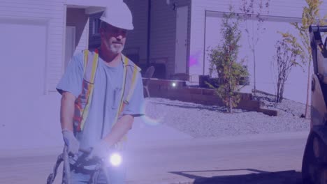 Animation-of-caucasian-male-worker-on-building-site-over-light-spots