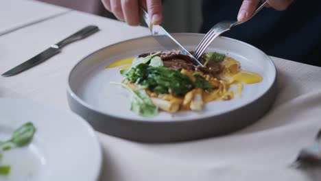 Man-having-beef-for-dinner-at-a-fancy-restaurant,-luxury-and-expensive-dish,-dolly-in-shot