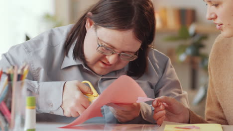 person with disability learning arts and crafts