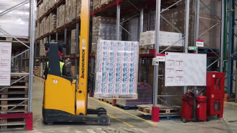 forklift loading pallet in a warehouse