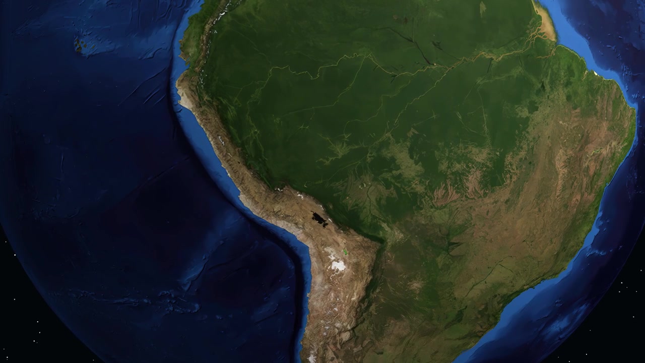 La Tierra digital gira y se acerca a Sudamérica, destacando Puerto Maldonado con texto informativo.
