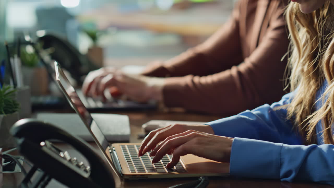 Company employees working laptops in office closeup. Businesspersons typing