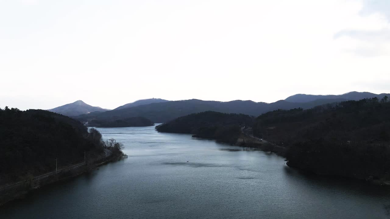 Aerial drone shot of beautiful cinematic South Korean river and forest in nature