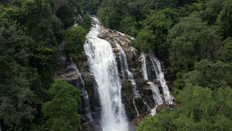 incredible cinematic view over massive waterfall in deep jungle