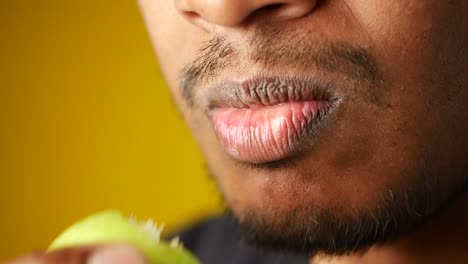 close-up of a person eating an apple